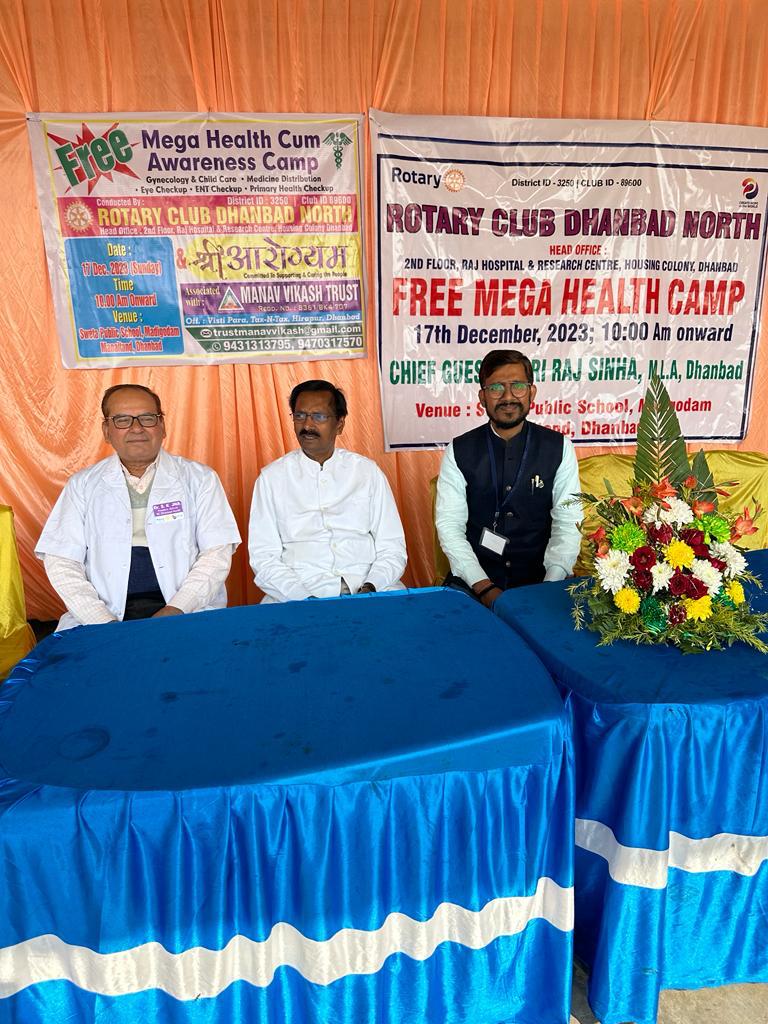 A photograph capturing a moment of community service and trust engagement.